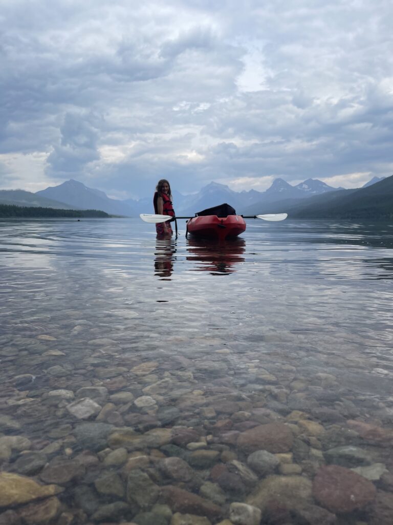 Kayaking at Lake McDonald. Stay at Glacier Bear Condo or Glacier Bear Cabin for your next vacation